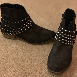 Black boots with studded straps around